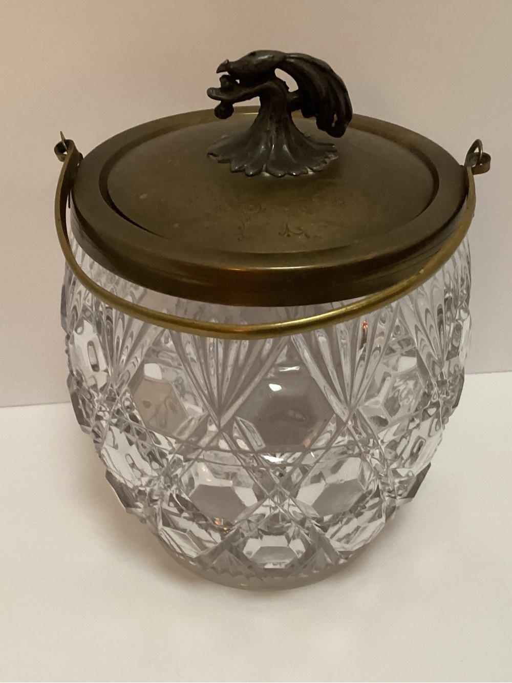 Vintage glass and brass biscuit jar bird finial.